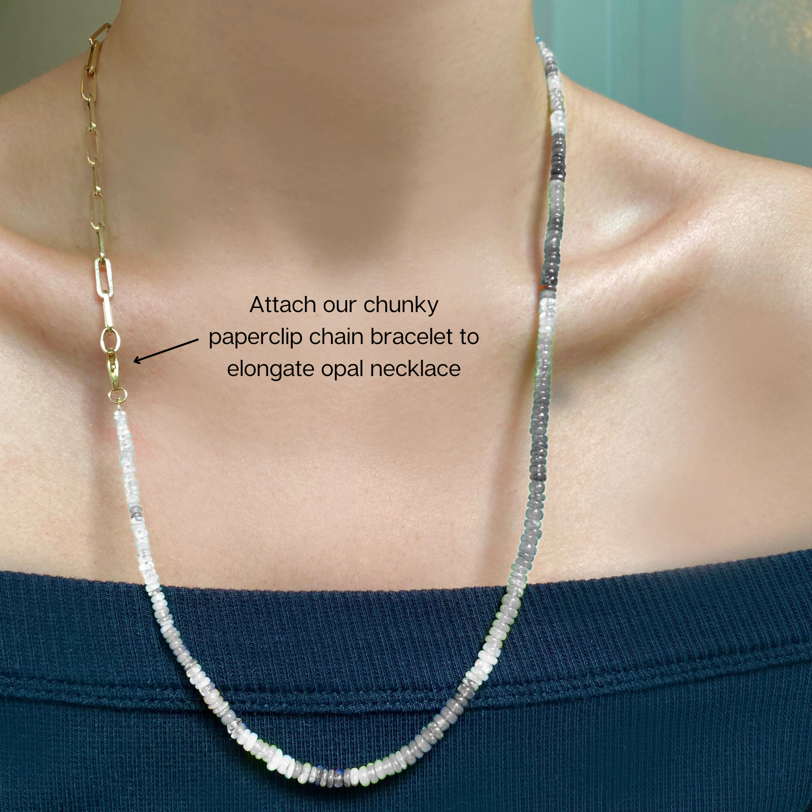 Shimmering beaded necklace made of faceted opals in shades of bright light blue on a gold linking ovals clasp. 