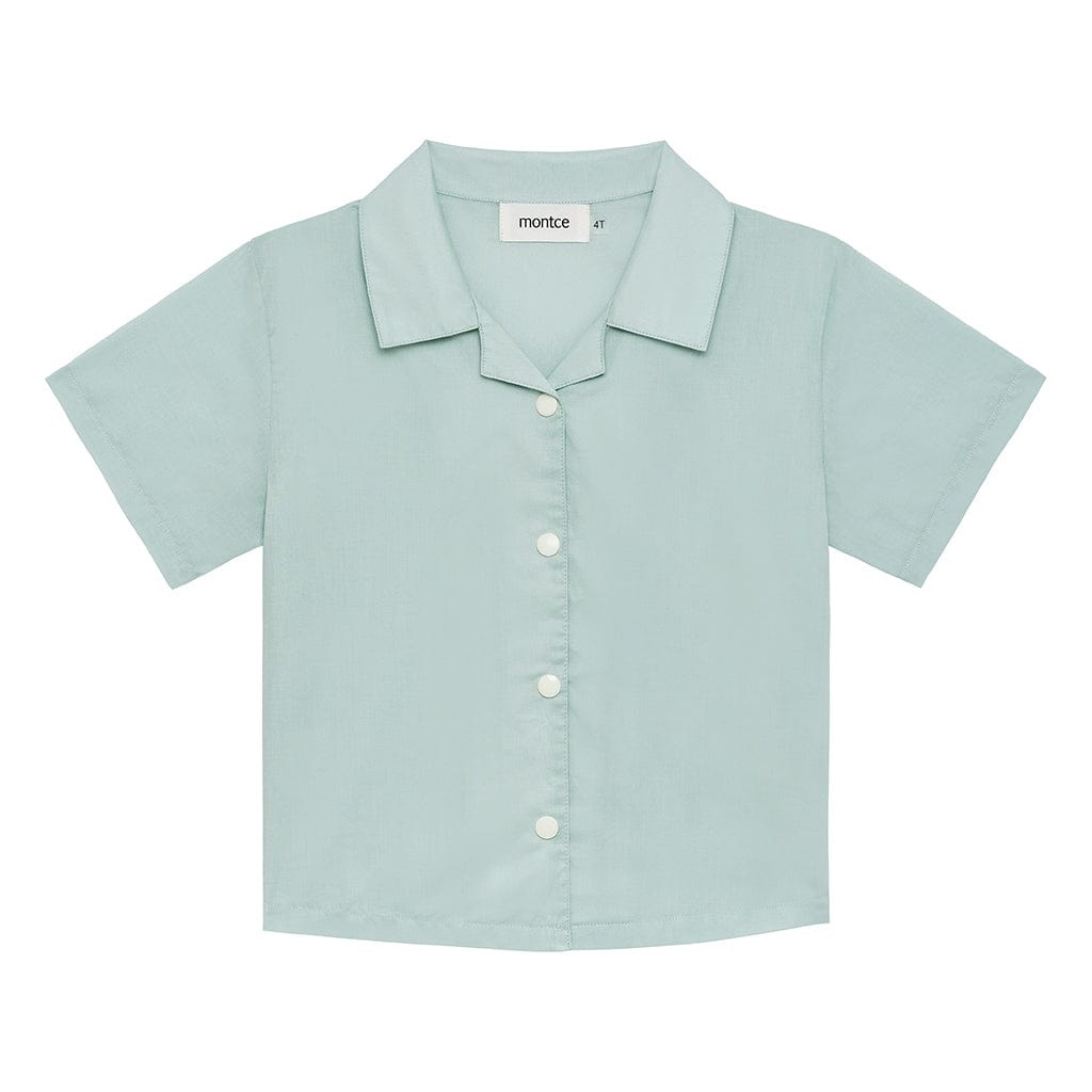 Powder blue short-sleeve button-down shirt with collar and white buttons on front.