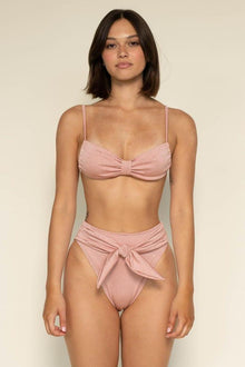 Pink textured bikini bottom with tie-up closure at center front.