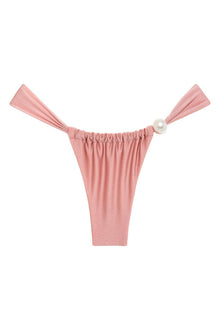 Rose pink bikini bottom with ruched front, tie-side straps, and pearl accent closure.