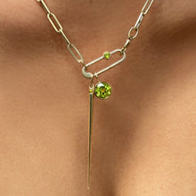 14k Peridot Quill Spike and Solitairte Charm with a paperclip charm lock styled on a gold semi-hallow paperclip chain necklace