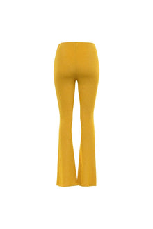 Gold flare pants with sparkly knit texture and wide legs shown from back view.
