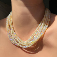 Supermoon opal necklaces layered on the neck.