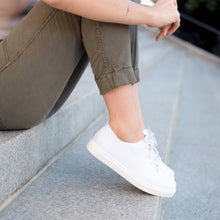 Image 1 Women's Kickaround Sneaker White Nisolo on Model
