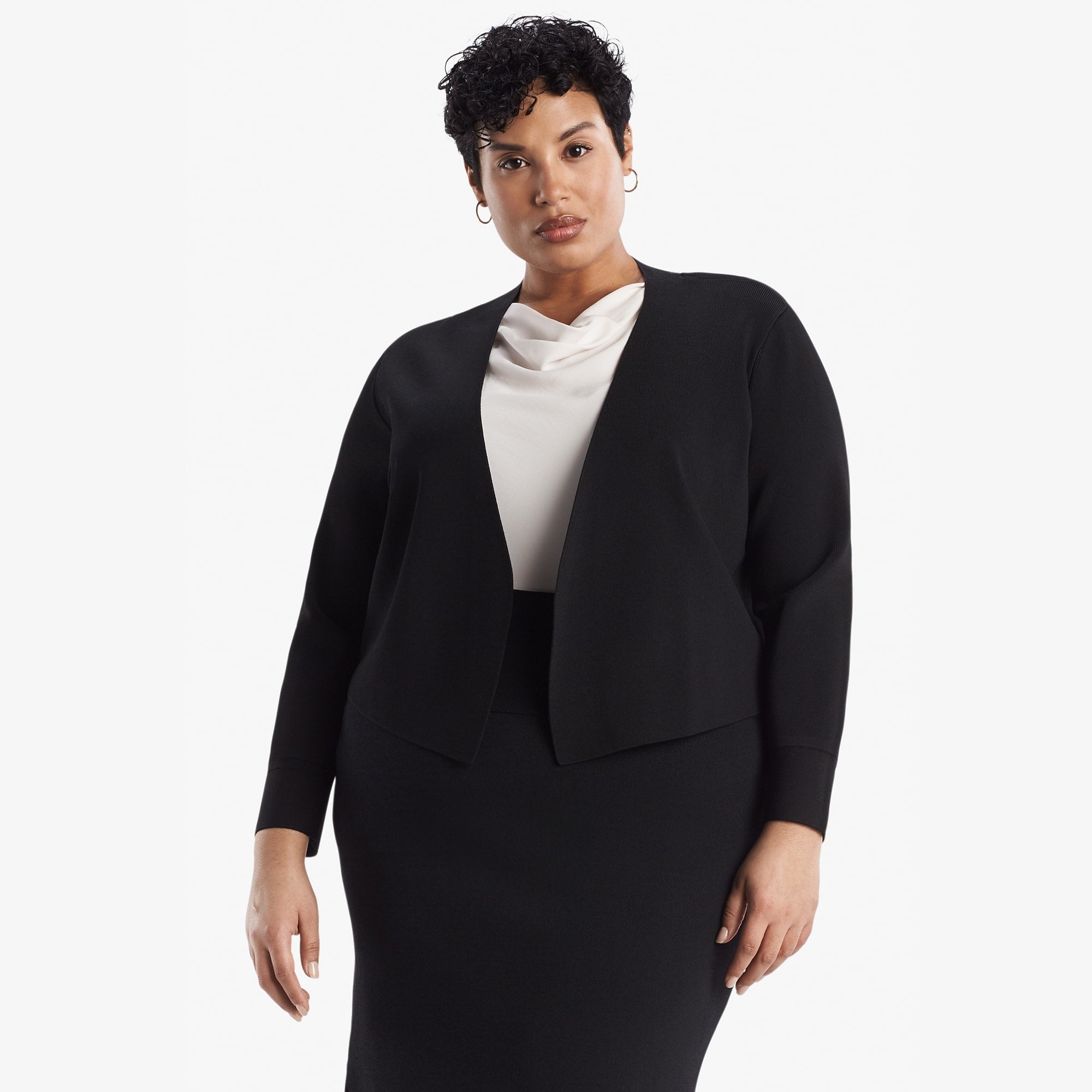 Front image of a woman standing wearing the Sant Ambroeus jardigan in black
