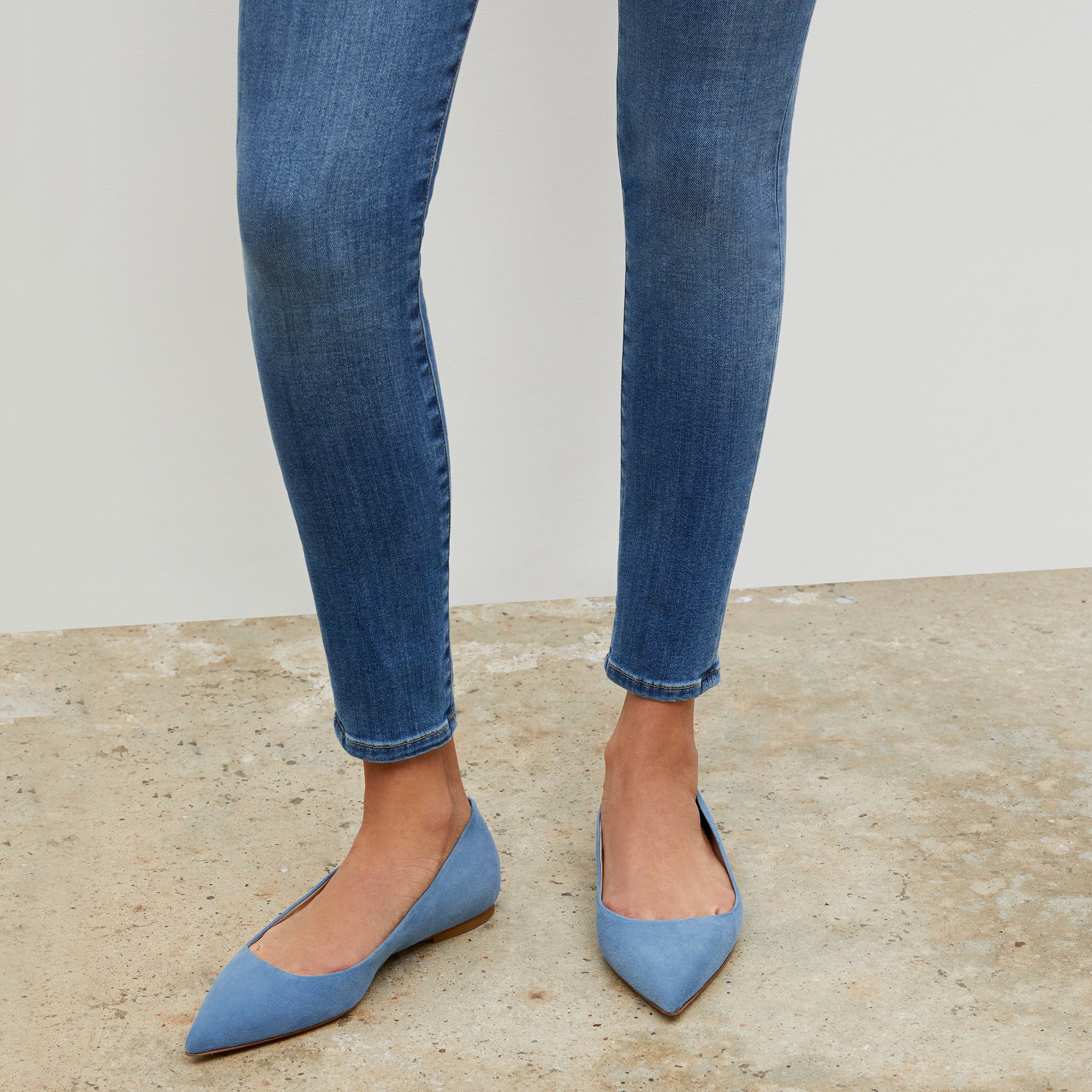 Woman standing wearing the Rowan flat in Sky Blue